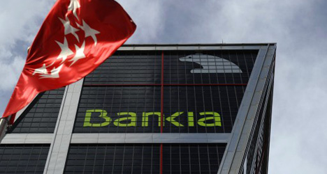 Downgrade deepens debt misery for Spanish banks