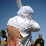 A "Picao" penitent bleeds after whipping himself during the "Santa Vera Cruz" brotherhood procession of the Holy Week in San Vicente de la Sonsierra, in Northern Spain, on April 18th.Photo: Rafa Rivas/AFP