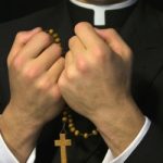 Charges dropped against 11 in priest abuse case