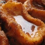 <b>Torrijas.</b> This scrumptious treat is very traditional for Easter, with recipes dating back to the 1600s. Thick pieces of bread are soaked in a mixture of milk and egg, then fried with olive oil and served with honey and sugar.Photo: Photo: <a href="http://bit.ly/1BVqSAr">Eduardo</a>/Wikipedia Commons