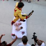 A 'colacho', or devil, jumps over a row of babies in the annual baby jumping festival near Burgos.Photo: Cesar Manso / AFP.