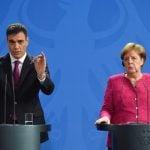 Spain and Greece accords help Merkel ease migrant row