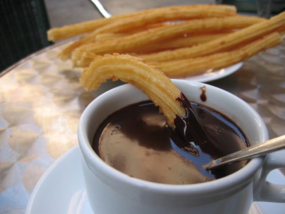 Madrid's Chocolatería San Ginés is one of the most iconic places to have to chocalate and churros in Spain. 
