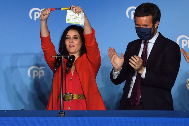 Madrid regional president Isabel Diaz Ayuso celebrates her victory in the Madrid regional elections in May with PP leader Pablo Casado. Photo: PIERRE-PHILIPPE MARCOU / AFP