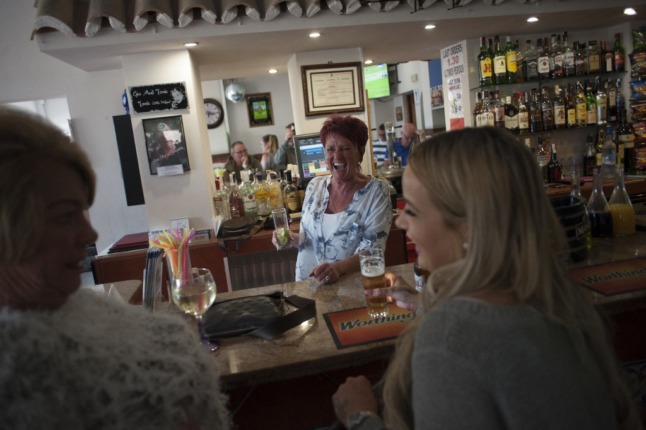 People drink in a bar in Benalmadena Spain 