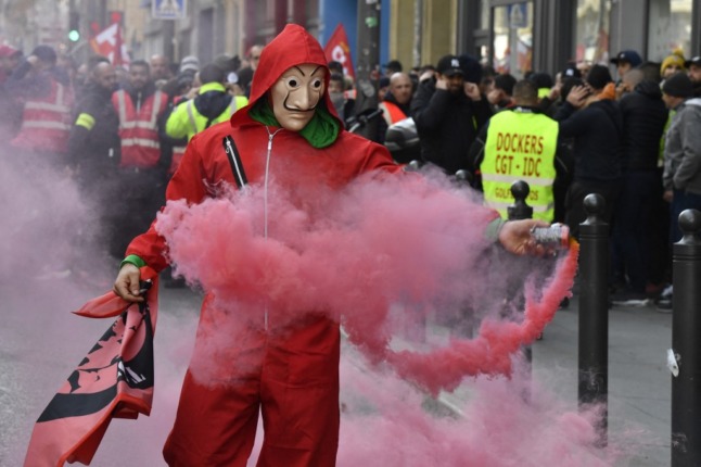 A demonstrator wearing the red jumpsuit and Dali mask of the Spanish Netflix hit series La Casa de Papel (Money Heist) during a demonstration in Marseille, France. Photo: Gerard Julien/AFP