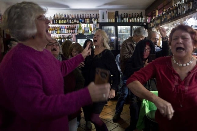 People dance at a British-owned pub during a Brexit celebration party in Jimera de Libar, Andalusia, on January 31st, 2020, as European officials removed the British flag from the ceremonial entrance of the European Council's Europa Building in Brussels on Friday ahead of Brexit. (Photo by JORGE GUERRERO / AFP)