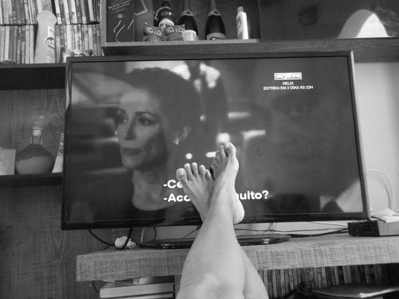 woman watching tv in spain , film credits